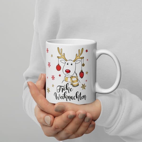 Süße Weihnachtstasse - Rentier - Kaffeetasse und Schokolade mit Geschenkverpackung zu Weihnachten. Beidseitig mit Gold bedruckt - er hält die Tasse